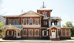 A decorated wooden house in red and white