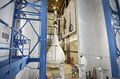 The Orion MPCV ground test vehicle is lifted into the acoustic chamber at Lockheed Martin's facilities near Denver in preparation for the Launch Abort Vehicle Configuration Test.