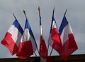 Multiple French flags as commonly flown from public buildings