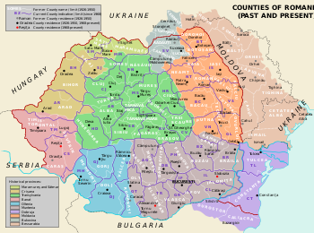 Outline showing the territory of present Romania and its into counties superimposed over the colored map of the inter-war counties.