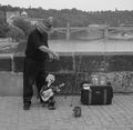 A puppeteer manipulating a Marionette in پراگ, Czech Republic