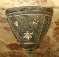 Djemdet Nasr stone bowl, once inlaid with mother-of-pearl, red paste, and bitumen.