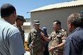 Egyptian army Capt. H.A. Rauof, center right, speaks with U.S. Soldiers assigned to the Regional Communications Center, Combined Joint Task Force (CJTF), 101st Airborne Division during their visit to the El 130827-A-YW808-026.jpg
