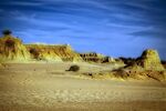 Sandy dunes with rocky outcrops