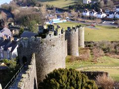 and the extensive defences of the newly planned towns, such as Conwy.