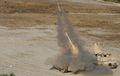 Marines with 2nd Combat Engineer Battalion launch a M58 MICLIC from an Assault Breacher Vehicle.