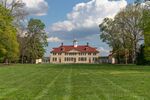 A large plantation house surrounded by trees