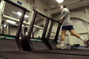 US Navy 070406-N-7130B-187 In the aft gym aboard the aircraft carrier USS Ronald Reagan (CVN 76), Master Chief Electronics Technician James Poletto, from New Milford, Conn., runs on the treadmill.jpg