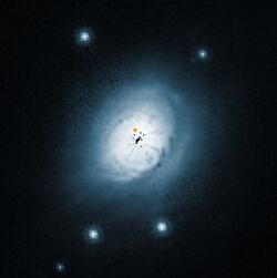 View of the dust disc around the young star HD 100546.jpg