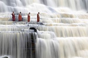 Meditating monks at Pongour Falls.jpg