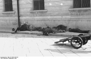 Bodies of uniformed men on a sidewalk