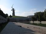 Memorial complex with a large sculpture of a woman holding a sword