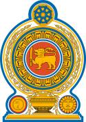 Coat of arms of Sri Lanka, showing a lion holding a sword in its right forepaw surrounded by a ring made from blue lotus petals which is placed on top of a grain vase sprouting rice grains to encircle it. A Dharmacakra is on the top while a sun and moon are at the bottom on each side of the vase.