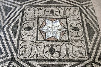 Ancient Roman star-shaped opus sectile inset within a tessellated (i.e. mosaic) pavement (Archaeological Museum, Aquileia)