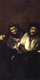 Two women laughing at a man