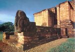 Entrance to a brown, squared temple.