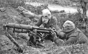 Vickers machine gun crew with gas masks
