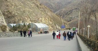 Pedestrians near the entrance to the complex.