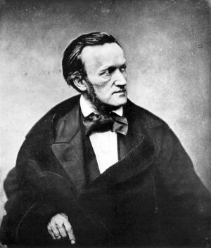 Half-length portrait of mature man in dark cape