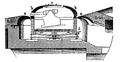 Coastal fortification with a rotating gun turret.