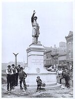 Workers finish installing Gelert's statue of a Chicago policeman in Haymarket Square, 1889. The statue now stands at the Chicago Police Headquarters.