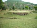 The ruined Bharhut Stupa; seen behind it is the Lal Pahadi (Red Mountain)