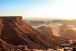 Desert setting with a plateau with steep slopes