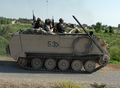 The M113, one of the most common tracked APCs, on duty during the Iraq War.