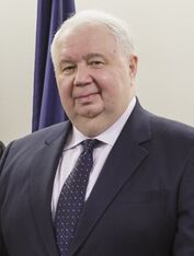 Chest height portrait of man in his sixties wearing a suit and tie