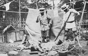 Koreans in Japan about to be stabbed by Japanese vigilantes with bamboo spears immediately after the Kanto earthquake.