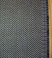 Example of the herringbone pattern, a popular choice for suits and outerwear
