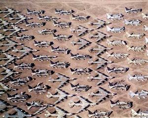 Aerial view of B-52s and other aircraft slowly being scrapped in the desert.