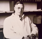 J. B. Collip in his office at McGill University ca. 1930.png