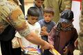 Afghan children receive school items from U.S. Soldiers with the regional communications center with Combined Joint Task Force (CJTF) 101, 101st Airborne Division and other military personnel at the El Salam 130827-A-YW808-018.jpg