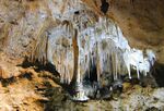 A cave with several dripstone formations